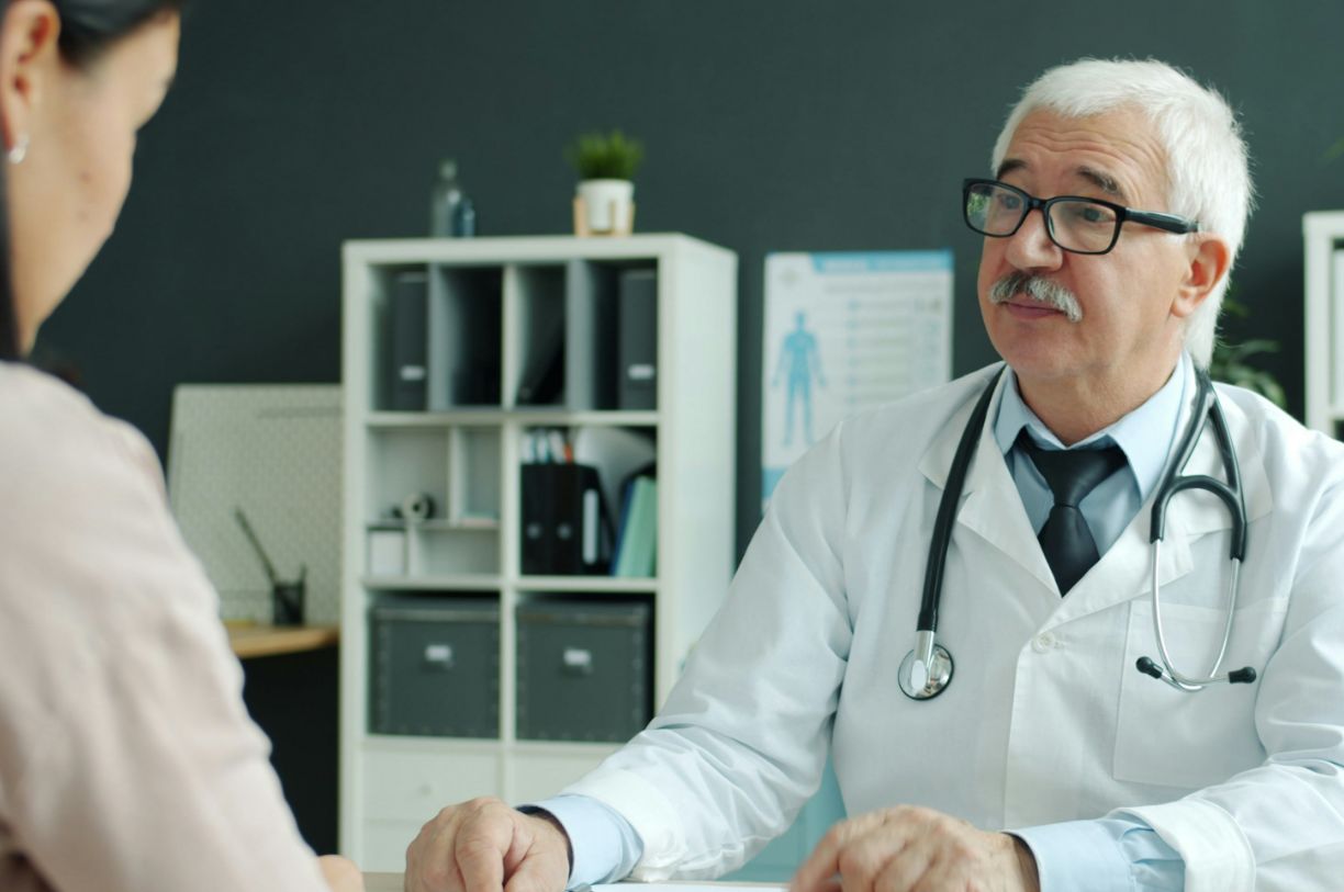 A healthcare professional sat opposite a patient